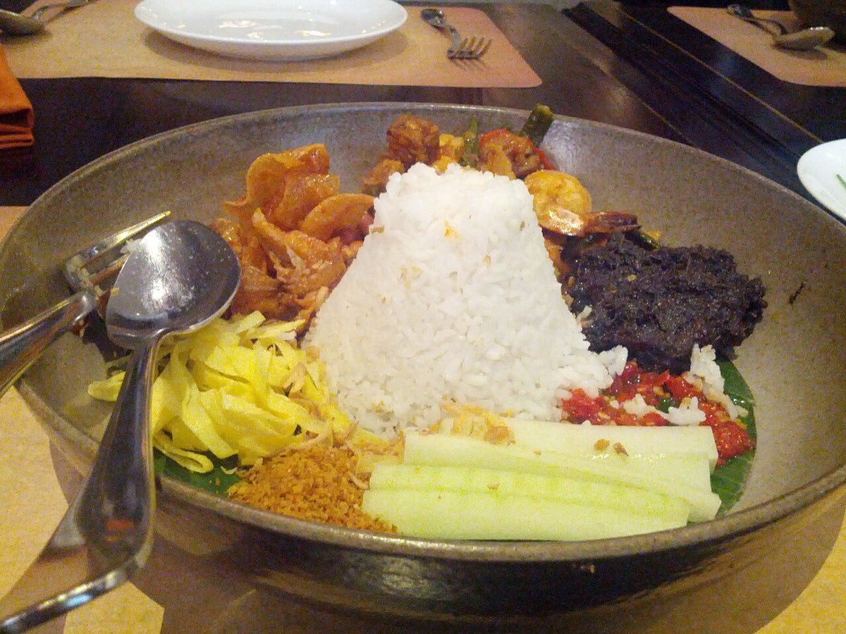 Nasi lemak with sambal, egg, peanuts and anchovies in Kuala Lumpur